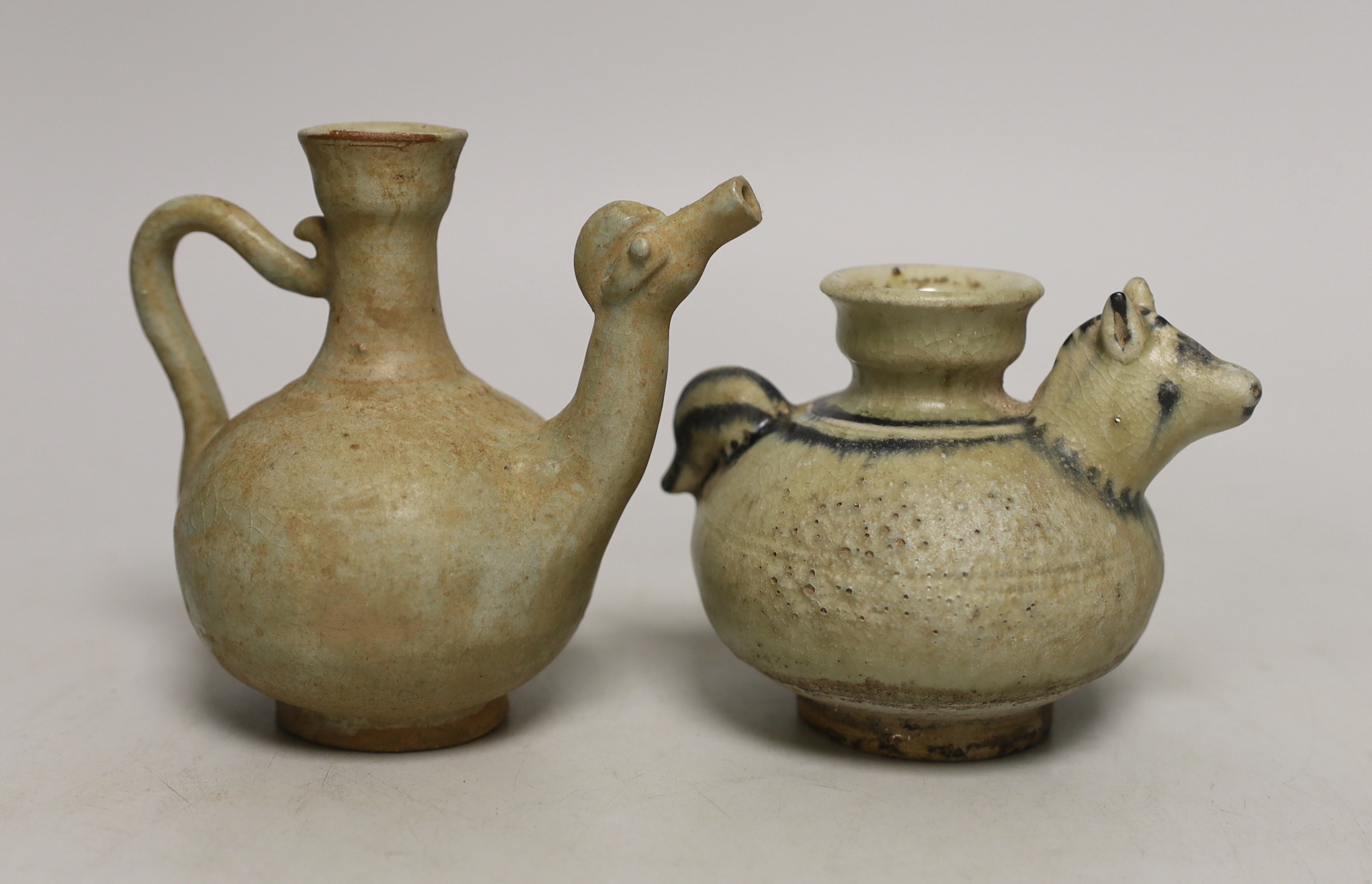 Two Thai Sawankhalok celadon glazed kendi, tallest 12cm high